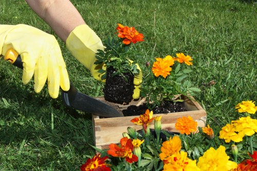 Operatives wearing PPE while working on a garden project